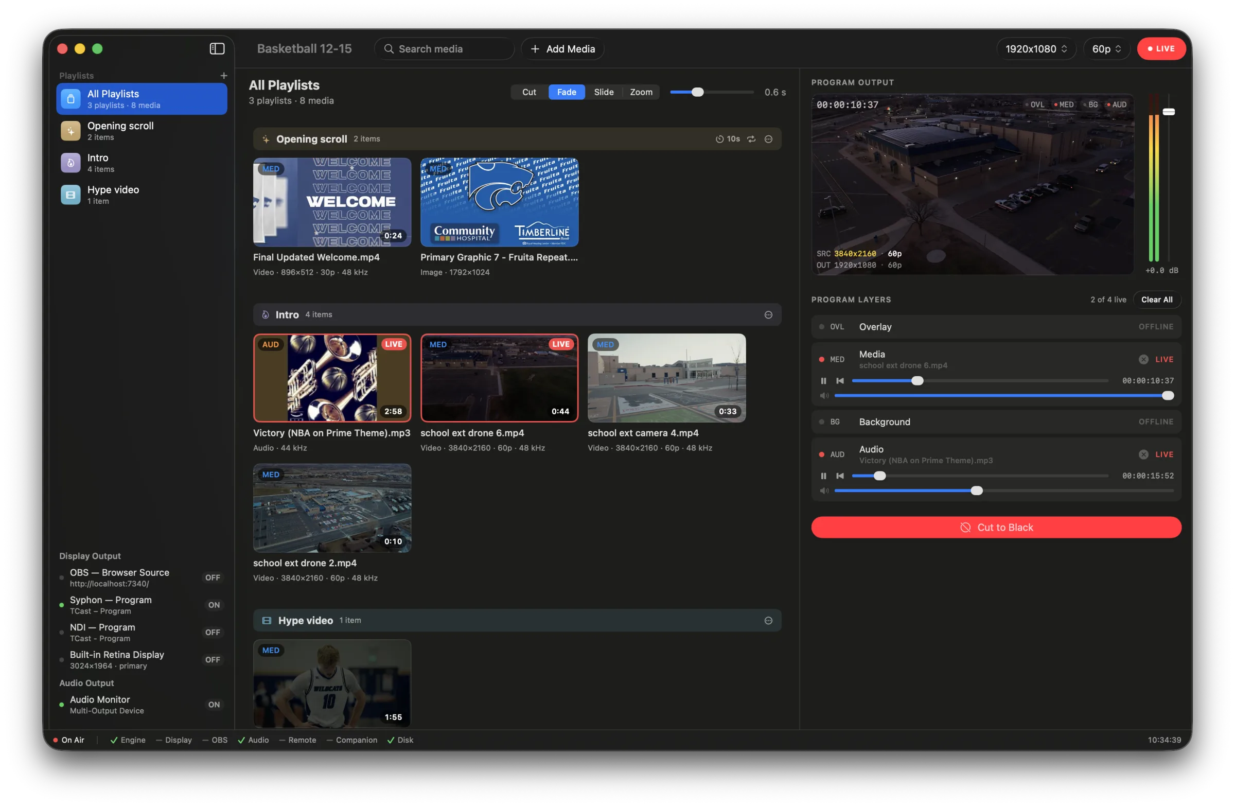 The TCast main window: playlist board with clips, one live with red tally, program output panel on the right.